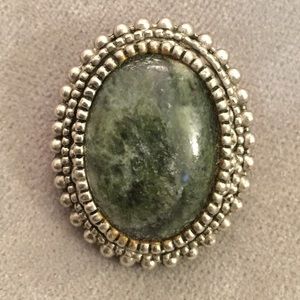 Oval metal with green stone pin